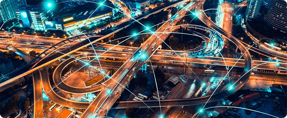 Looking down at motorway offramp and lanes at night