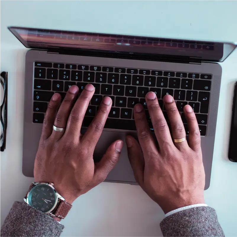 Hands on laptop keyboard