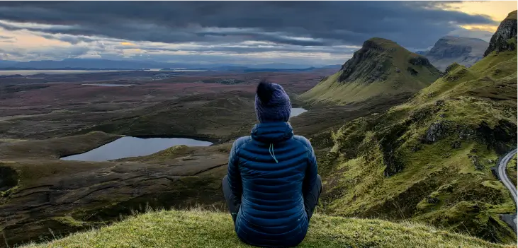 A woman looking at distant mountains